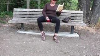 Lovely crossdresser jerks it on a park bench
