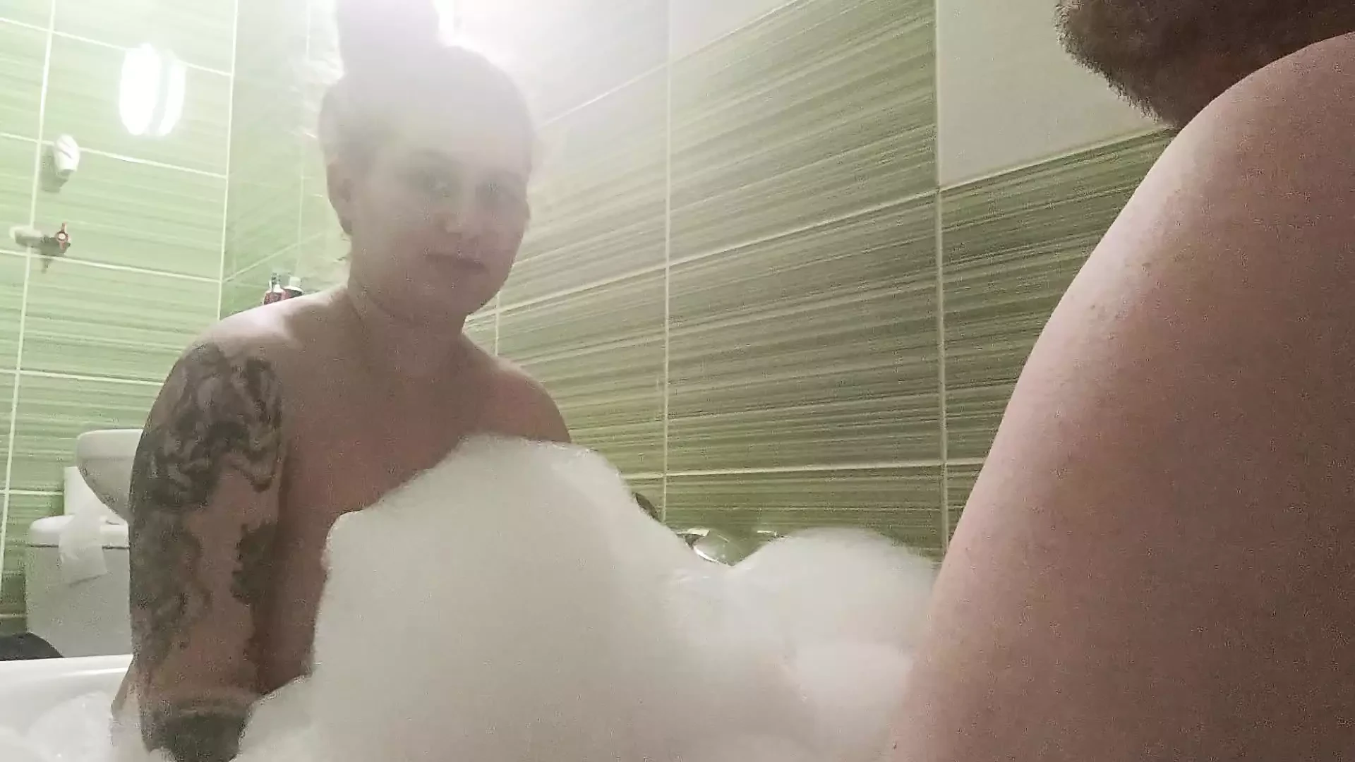 Couple take a bath and he touch her busty body
