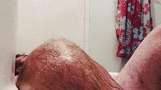 Taking an oil bath with a big cock on my face