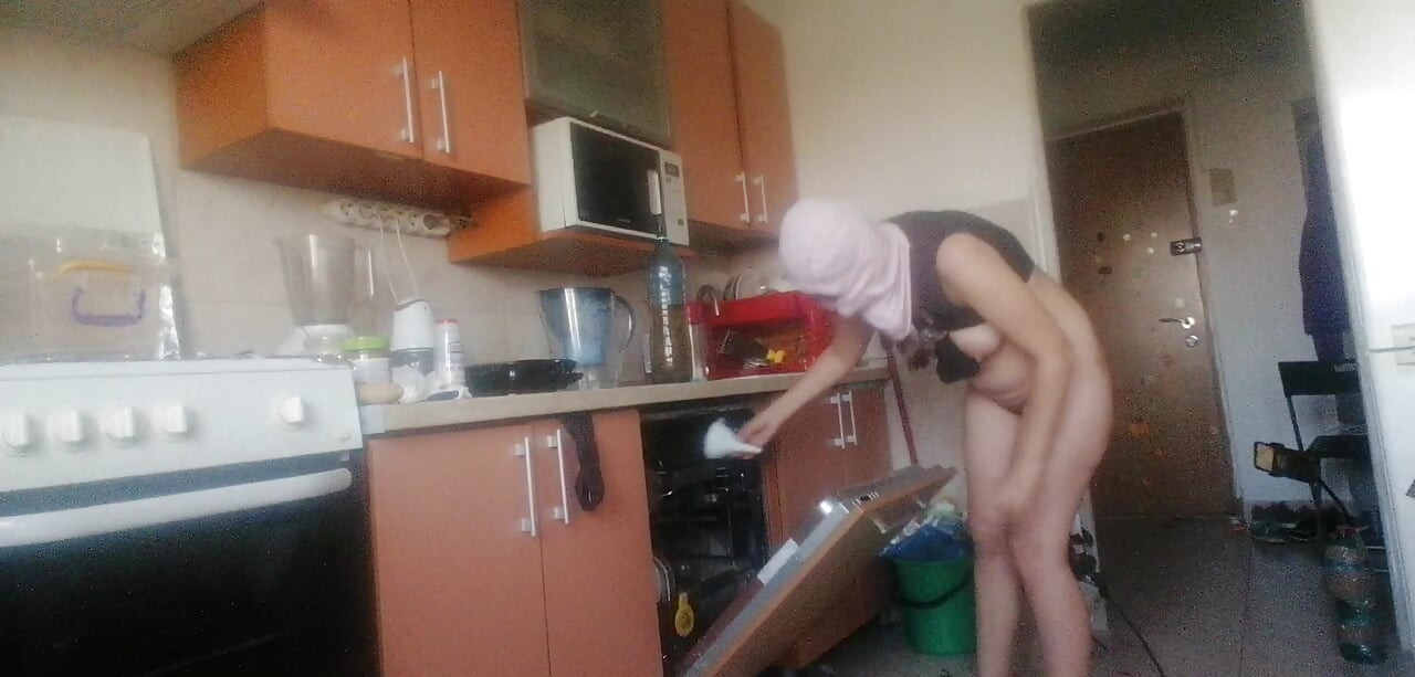 Sexy nude wife preparing food in the kitchen. Hairy brown hair, big ass, big tits