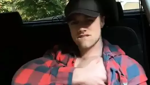 Hot Dude with Baseball Cap jerks off in car and cums on ches