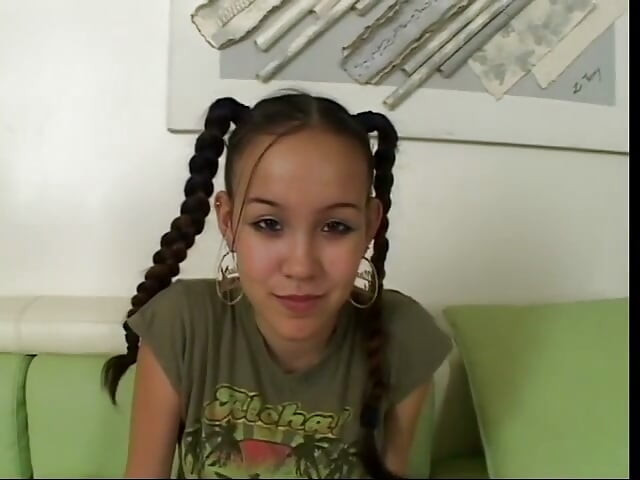 Brunette with pigtails sucks and slurps a fat cock on couch