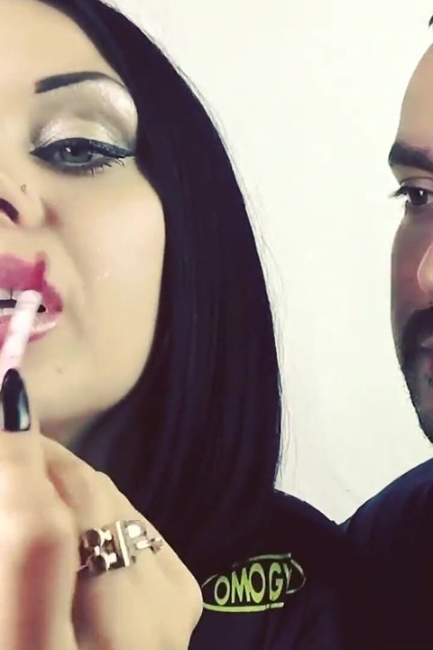 Covering Alex with red shiny lipstick kisses all over his face!