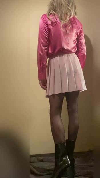 Young cute sissy in pink satin blouse and mini skirt