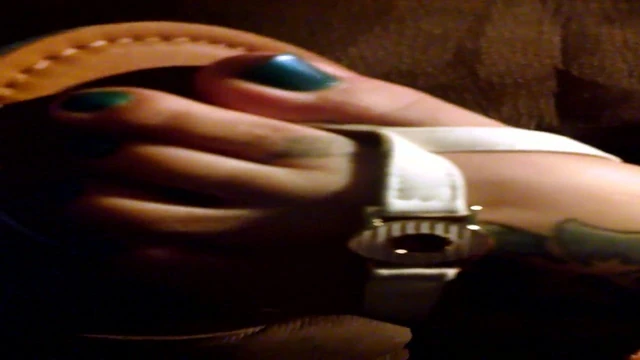 Wife in sandals shoeplay