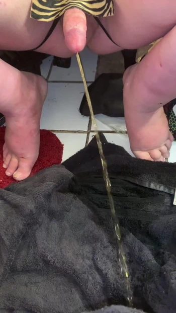 Must-see moment from "Squatting and Pissing on Floor With Hard Dick While My Mate Films It Compilation"