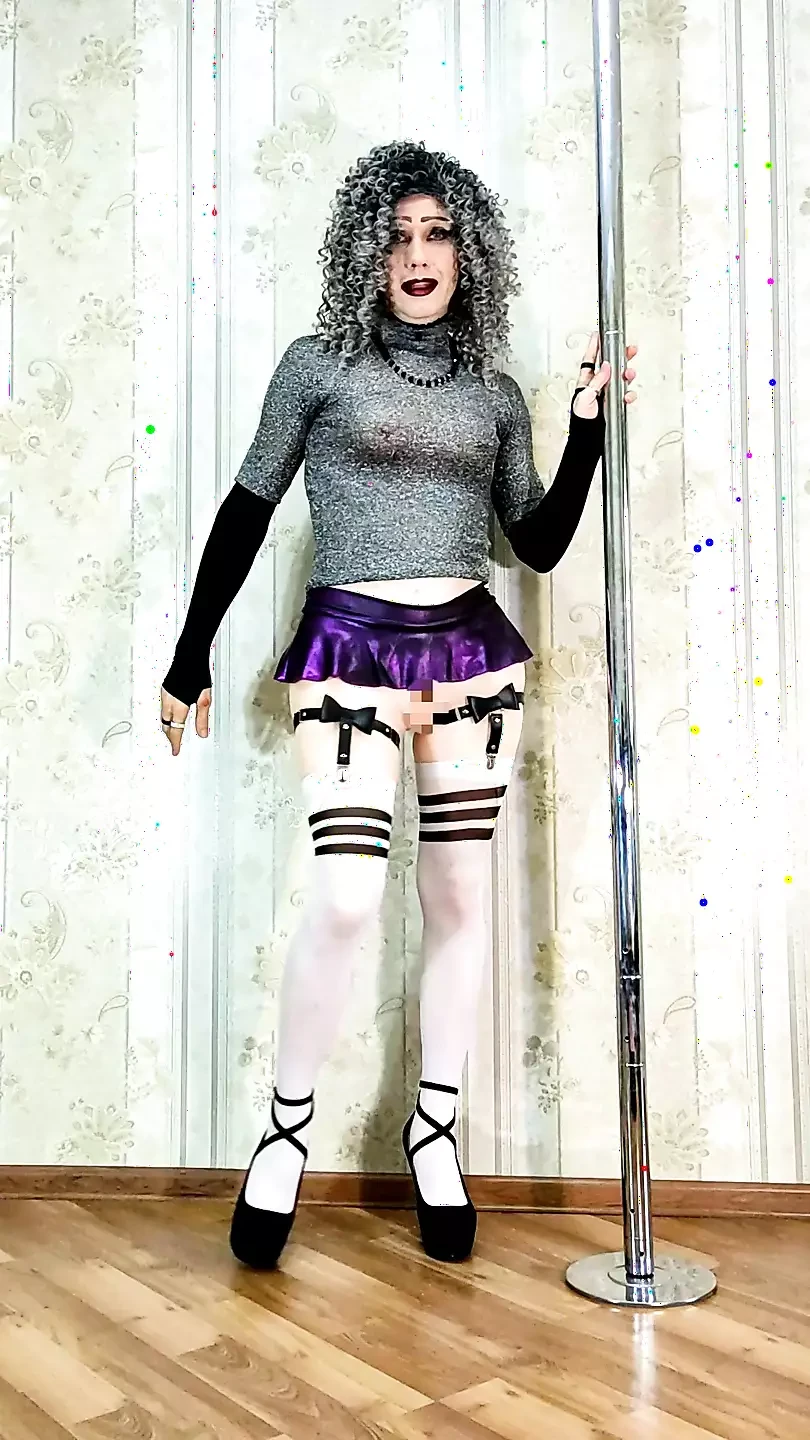 Slender sisi girl with protruding nipples in a high-heeled miniskirt, in biskis, stockings with garters
