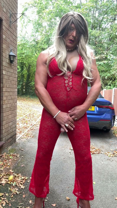 Sexy Crossdresser kellycd2022 in sexy red jumpsuit and heels | Clip 1