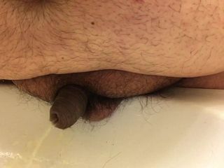 ultra close view of chub's tiny uncut willy peeing