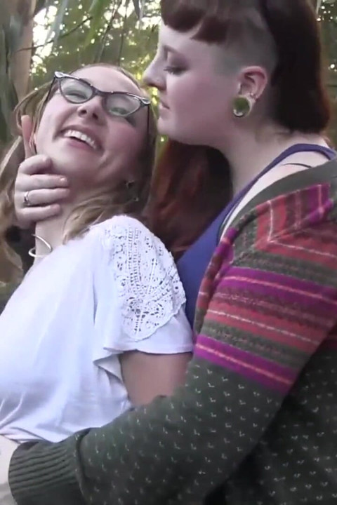 Outdoor lesbian licking.