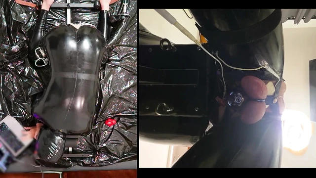 Session in the pillory with Latex Catsuit, PA Chastity, Giant Didildo and Estim