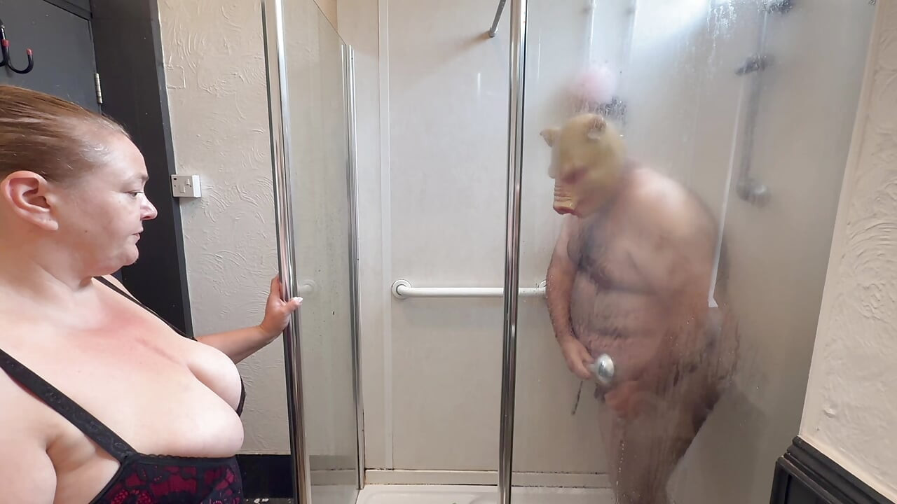 Domina Satana and Satana's piggy in the shower.