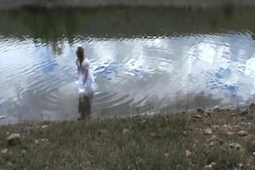 big wedding gown in a lake