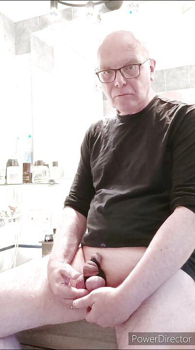 small caged cock and toothbrush