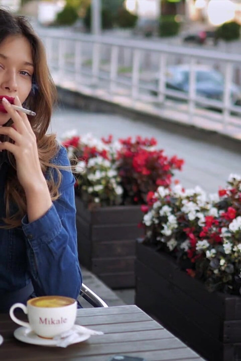 Magnetic Russian Beauty Playing with Cigarette Smoke