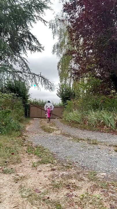 In a gardener outfit with a pink dress for a day