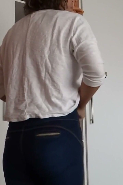 After Urinating, the Stepmother Puts on Very Tight Jeans, Revealing Her Panties