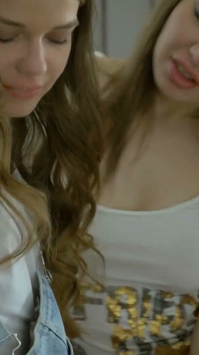 Cute teens are playing on PlayStation and playfully start kissing, exploring lesbian adventures | Clip 1