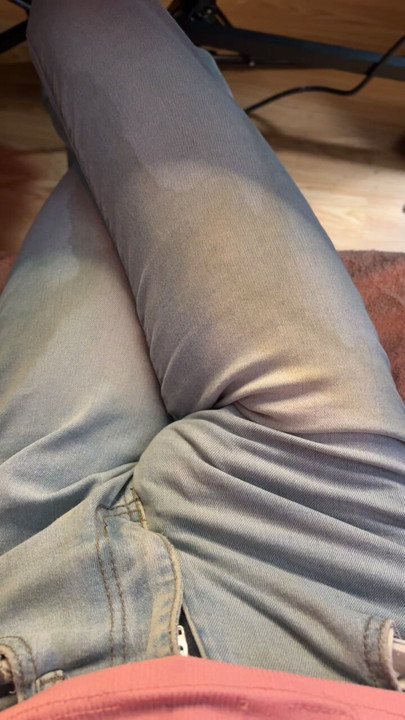 Chasity caged and peeing already pee stained jeans while gaming