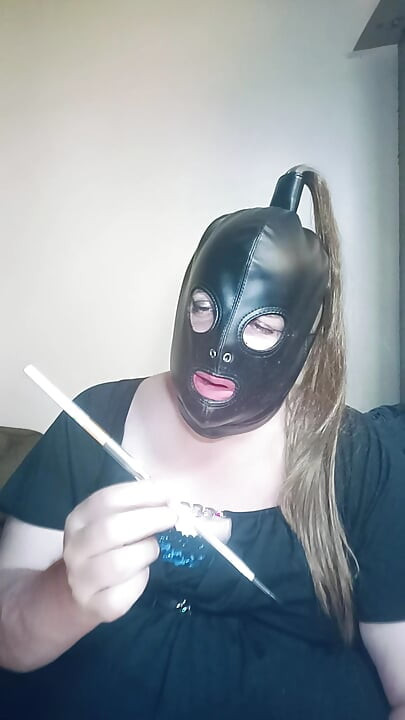 BBW TV Stephanie-Nicole smokes a cigarette in a silver holder.