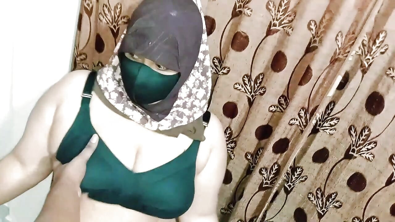 Hijabi girl takes off her clothes and wears a saree. Those big breasts are visible.