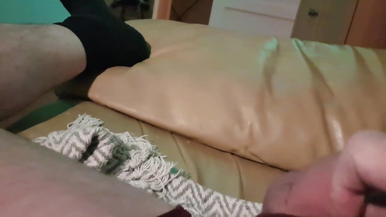 My Friend Is Lying on the Sofa in the Wet on a Wet Little Hole, He Jerks off His Cock