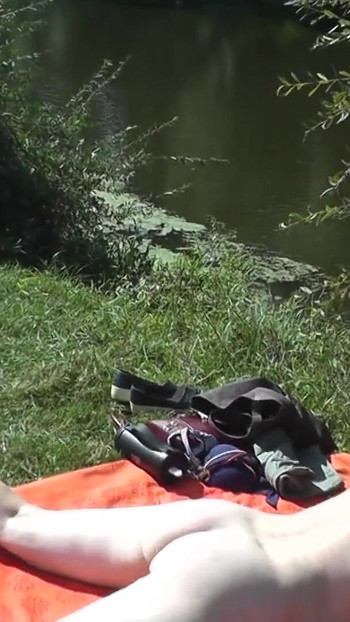Spectacular moment from "Wild beach Part one. Summer Outdoors beautiful blonde MILF sunbathing naked on river bank. Nudist"