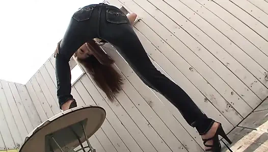 Skinny girl moans in pleasure as she gets fucked by a huge cock through torn jeans