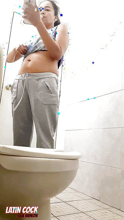 SEXY HOUSEWIFE CAUGHT ON VIDEO PEEING WHILE SMOKING