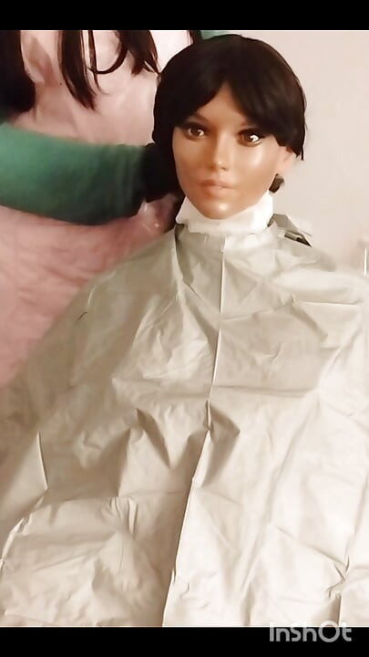 Ebony Sex doll Nikki shows off vinyl shampoo capes