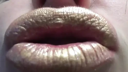 Golden lips teasing and lollipop sucking and licking