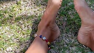 Sexy feet teasing outdoors