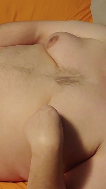 Emotional moment from "Chubby guy pinches nipples and cums"