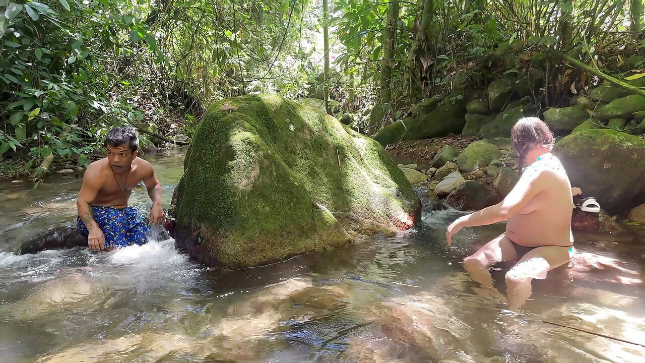 I find a midget pervert watching me in the river while I bathe naked, I see that he has a huge cock so I ask him to fuck me.