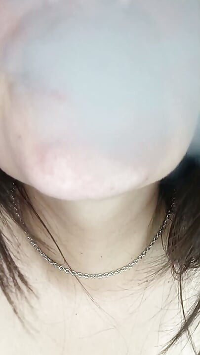 A Chubby Girl Smoking and Playing with Her Boobs