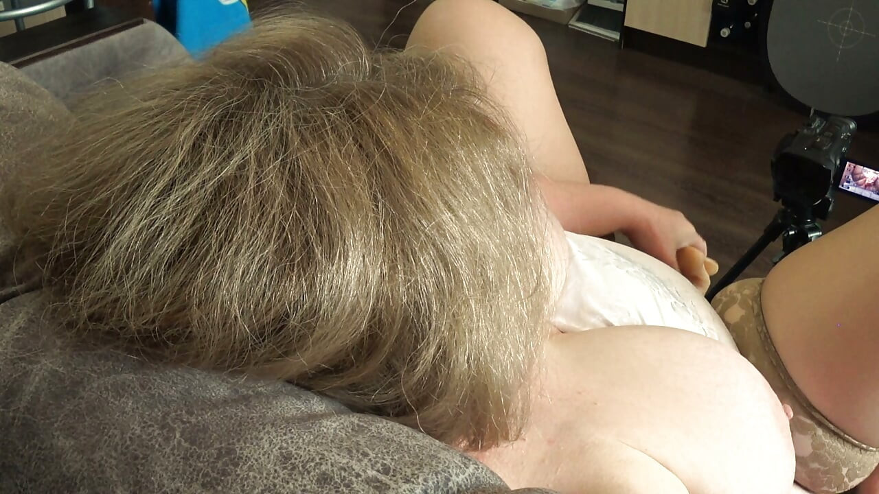 Big Tits From Above. a Camera Watches From the Side as a Plump MILF Masturbates and Records a Video.