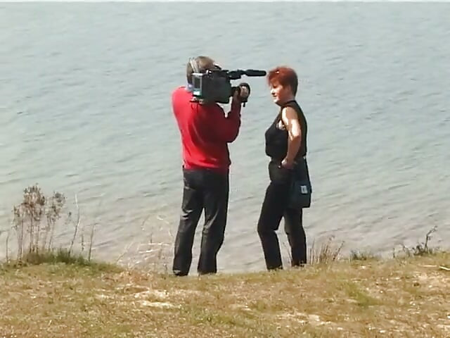 Redhead mature interviewed in the open