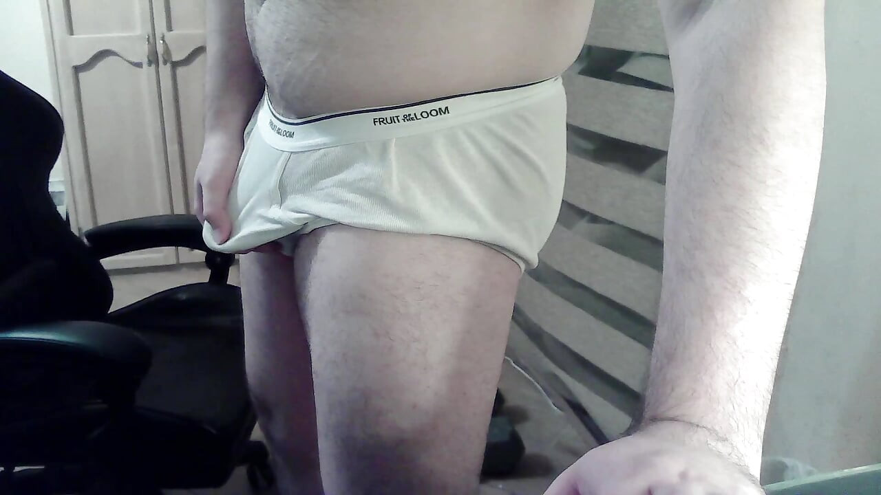 Hot beefy camboy shows off the goods during a show