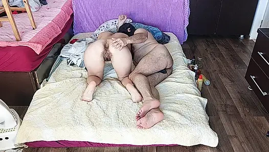 Sensual massage of a hot couple with oil on the body.
