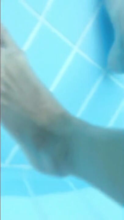Pulling Cock of Swimtrunks in the Pool ( Cock and Feet Underwater )