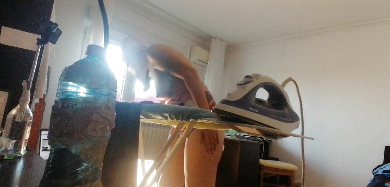 Amateur wife doing housework naked. Sexy and naughty wife trying on clothes that she cuts.