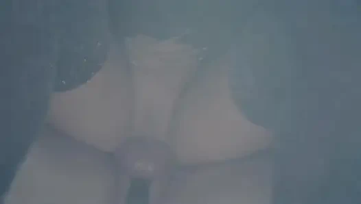 Dominatrix playing games with her imprisoned slave