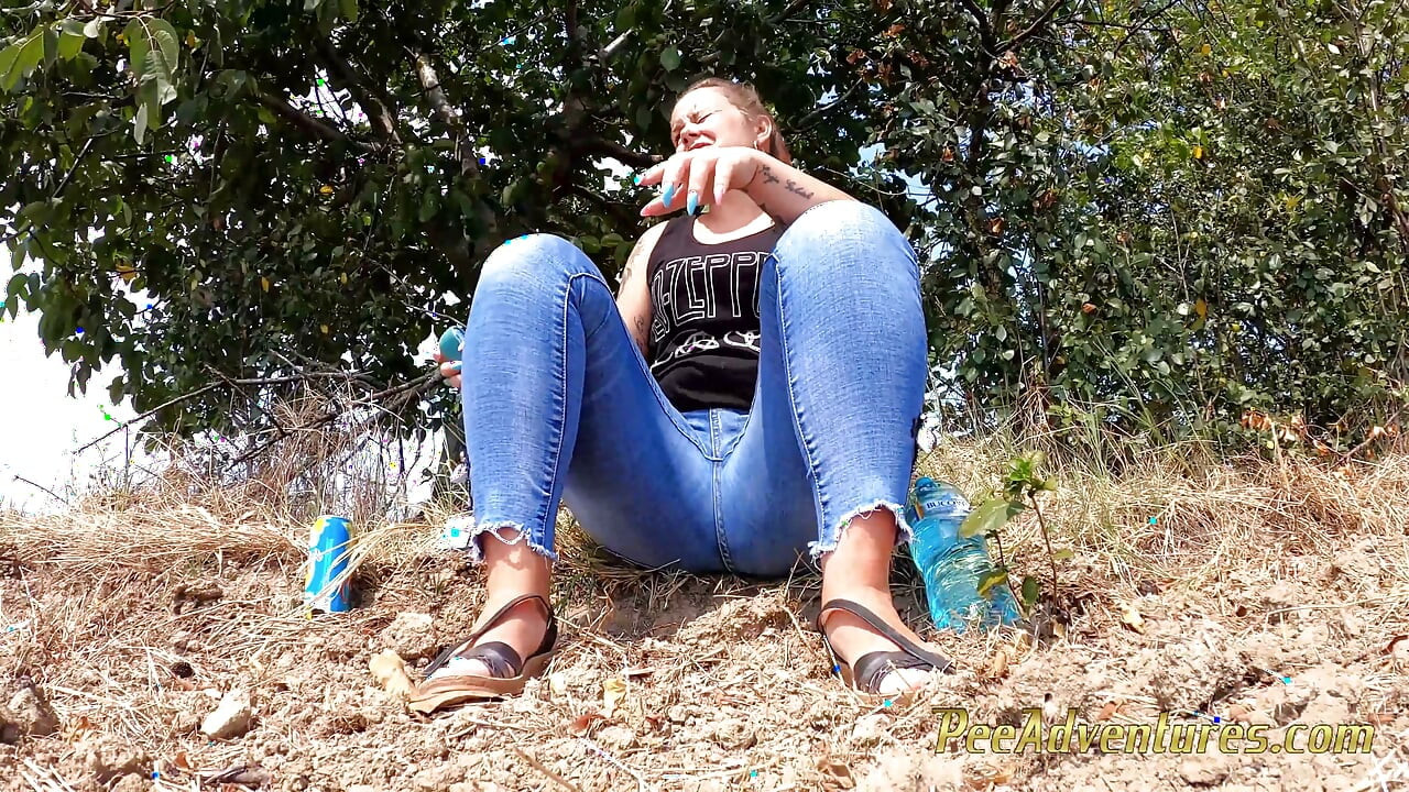 Chubby girl talking on the phone with her boy friend pee in her jeans