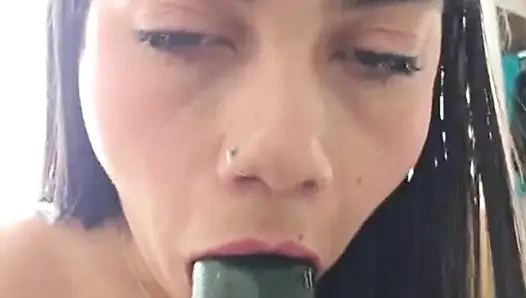 Playing with a delicious cucumber