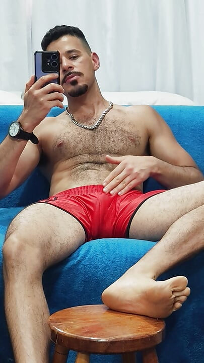 Teasing with red football shorts
