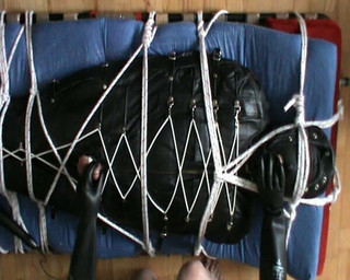 In the leather bodybag, slave gets a CBT by NeonWand