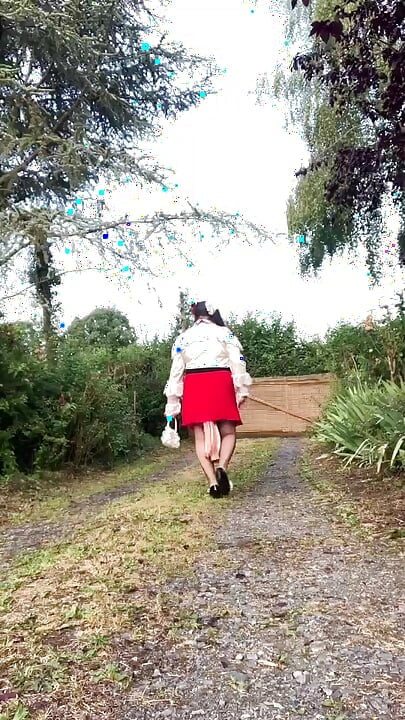In an outfit with a little red skirt and a new blouse for an evening out.