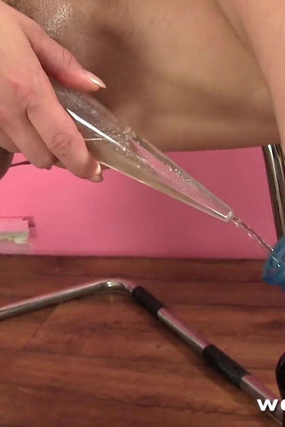 Teen pisses into a funnel and cums