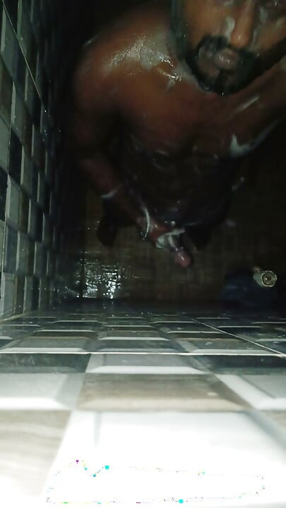 Hot Indian man bathing and playing and cleaning his big cock