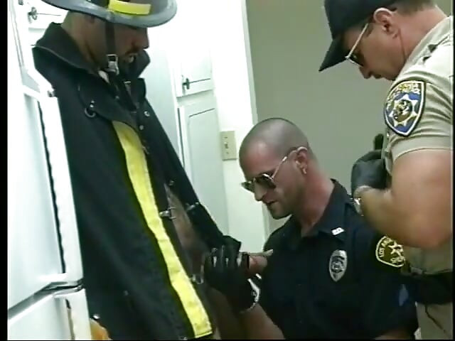 Naughty fireman fucks gay police officer's ass on couch then cums on his abs